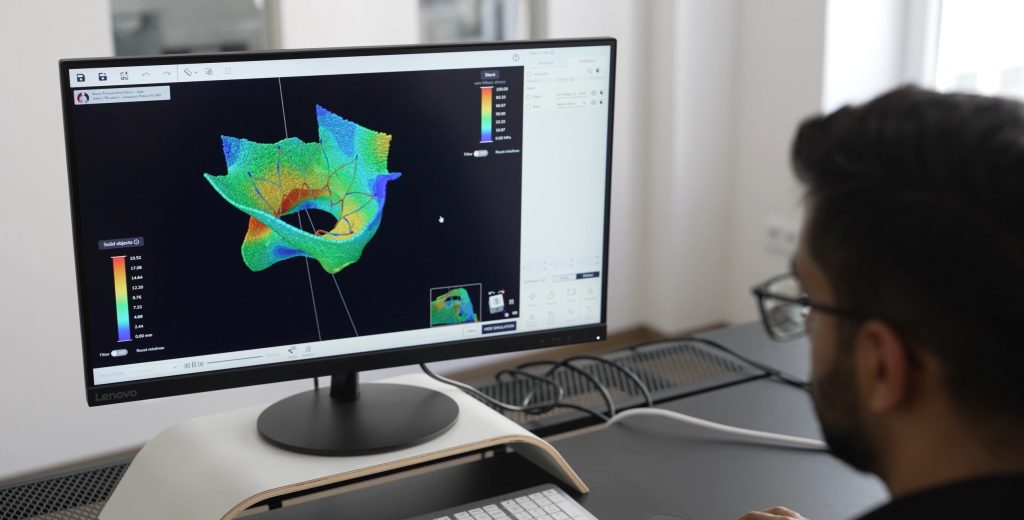 A user using in silico (computer modeling) via Simulation features in digital twinning product v-Patients
